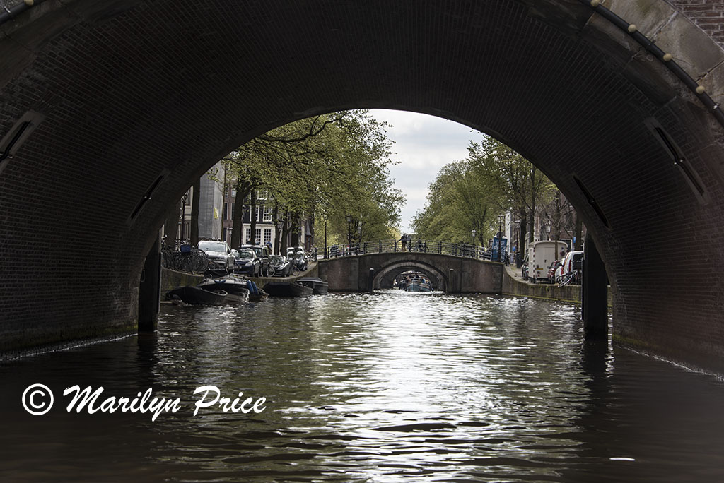 View up a side canal seen on the canal cruise, Amsterdam, Netherlands