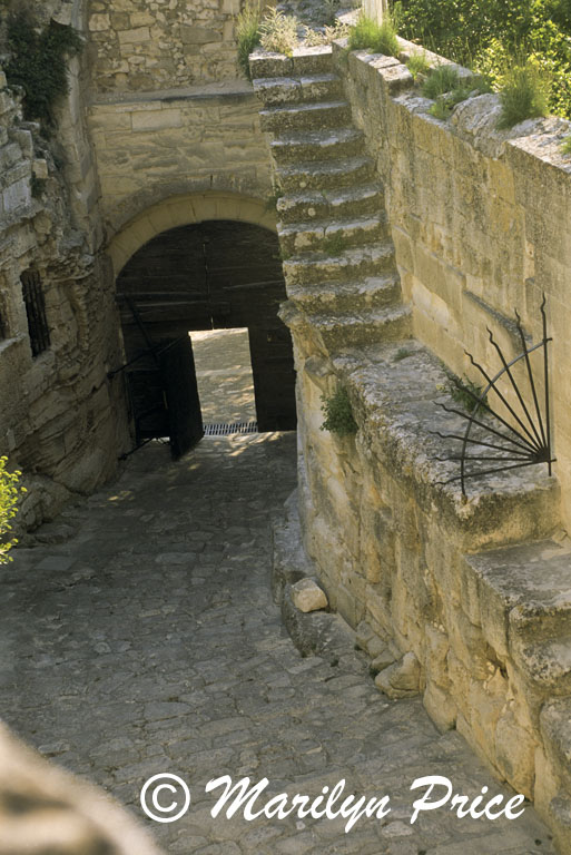 Cobbled street and arched passageway, Les Baux, France
