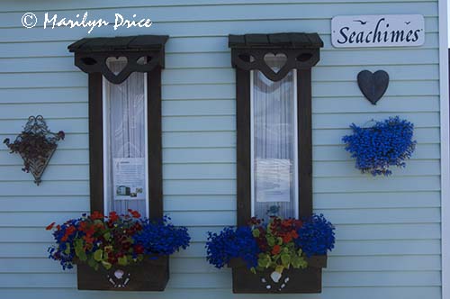 Windows and flowerboxes on a houseboat, Fisherman's Wharf, Victoia, BC